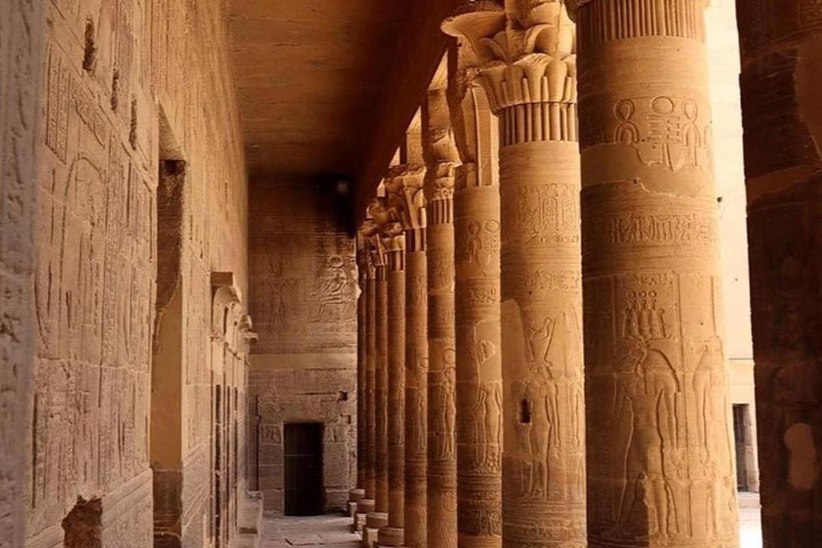 a row of columns in a building with writing on them