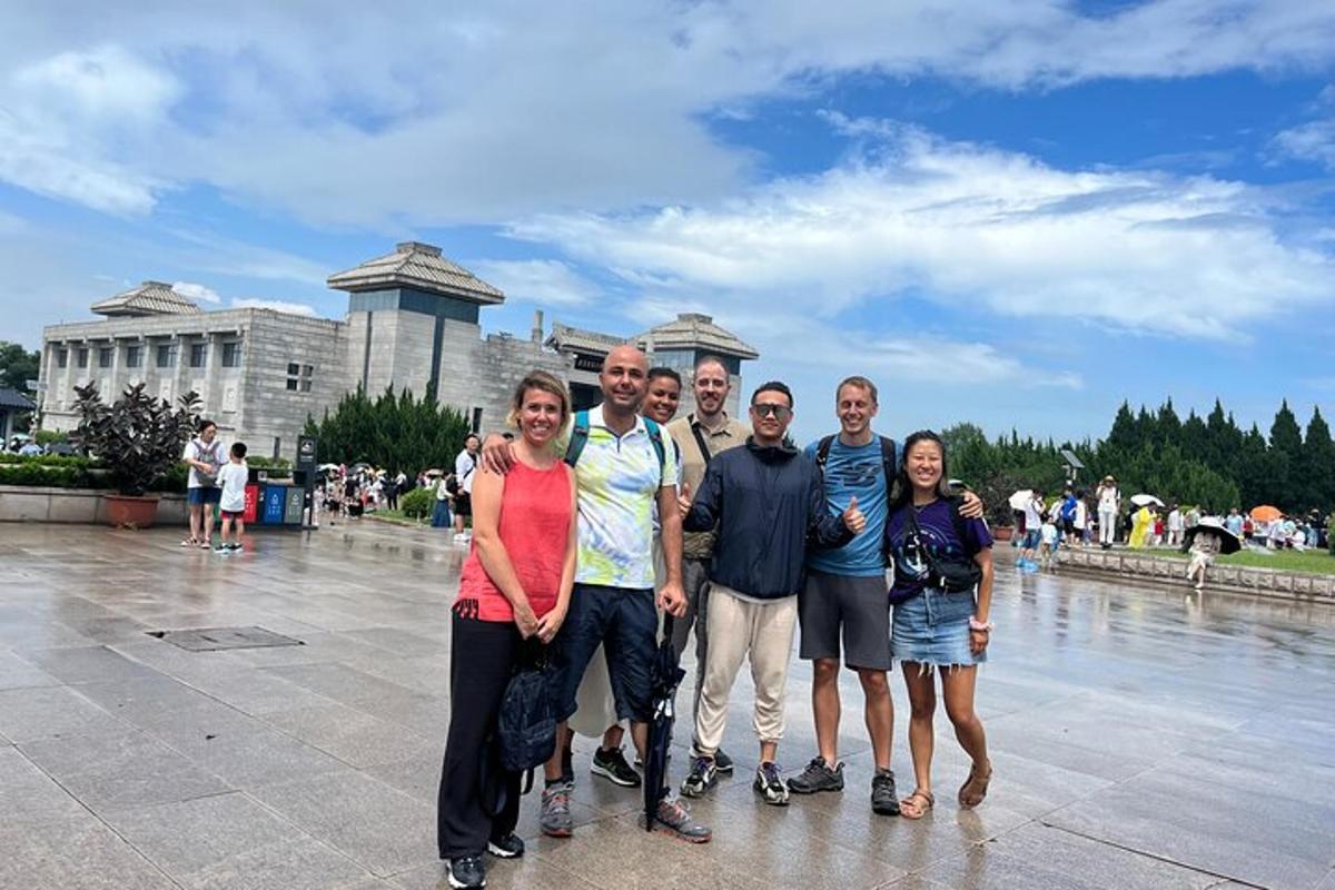 a group of people standing in front of a fountain