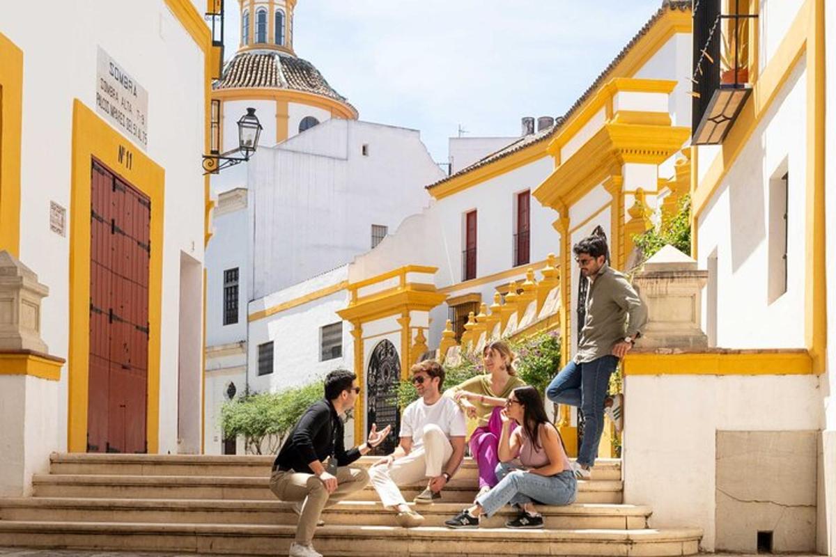 a group of people sitting on the steps of a building