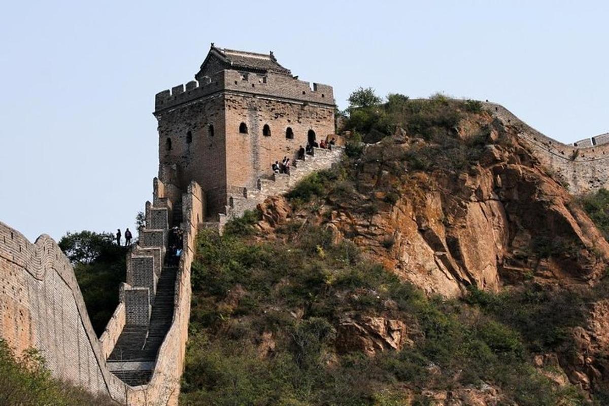 a castle on the side of a mountain with stairs