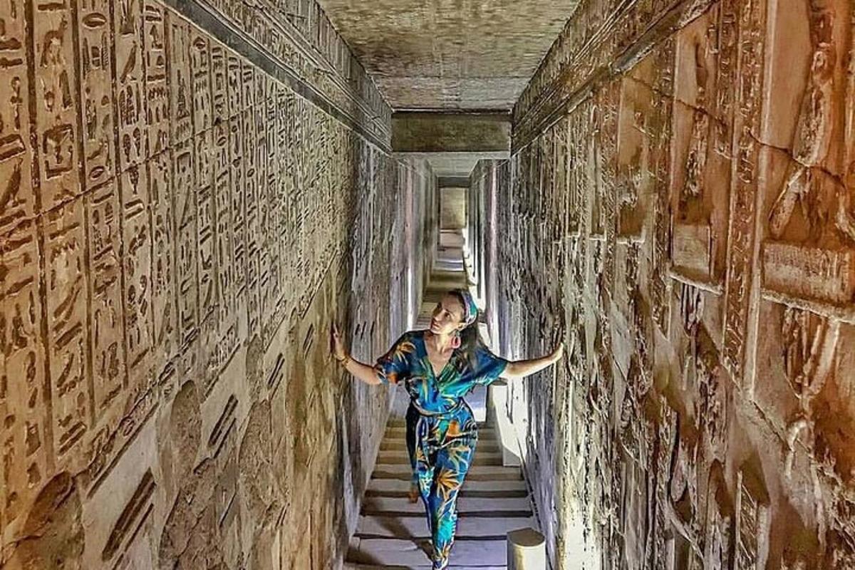 a woman walking down a stairs in a tunnel