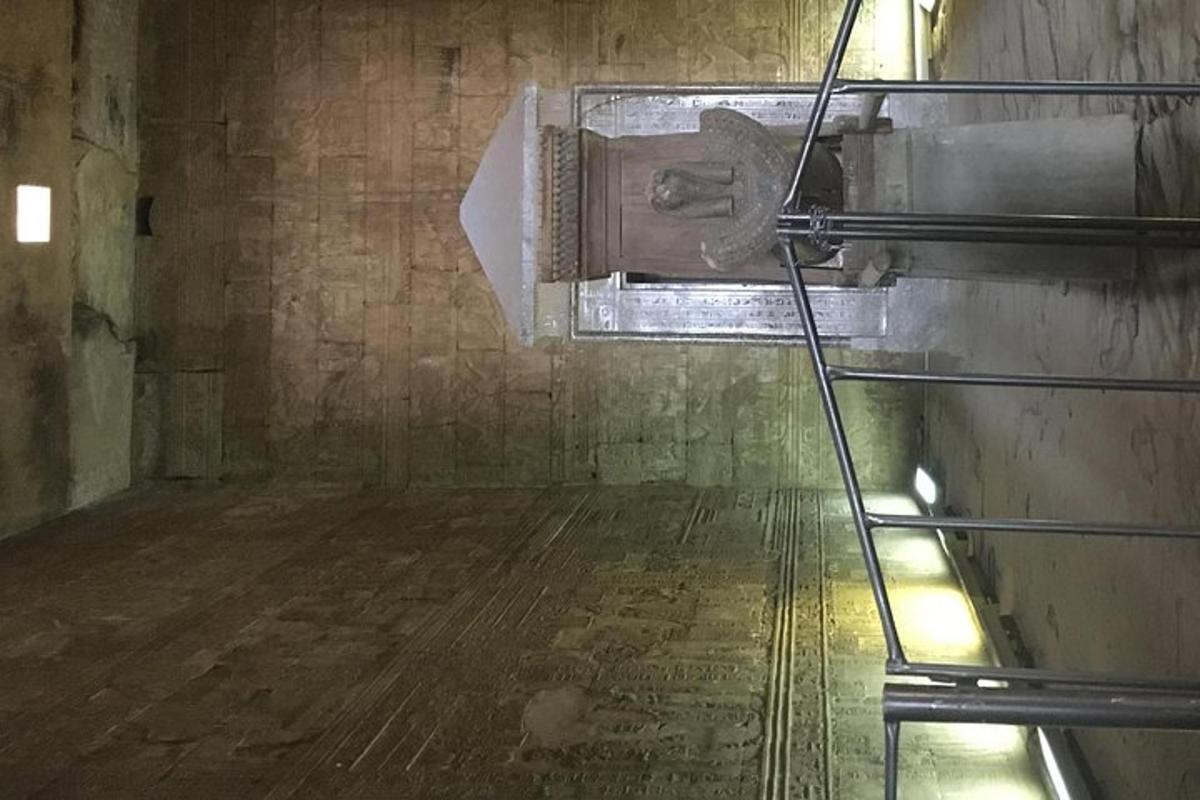 an empty room with a toilet in a building