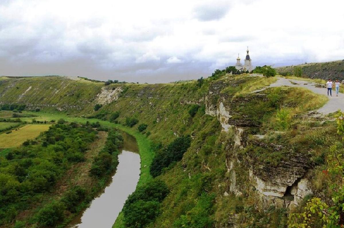 an aerial view of a river on a hill with a castle