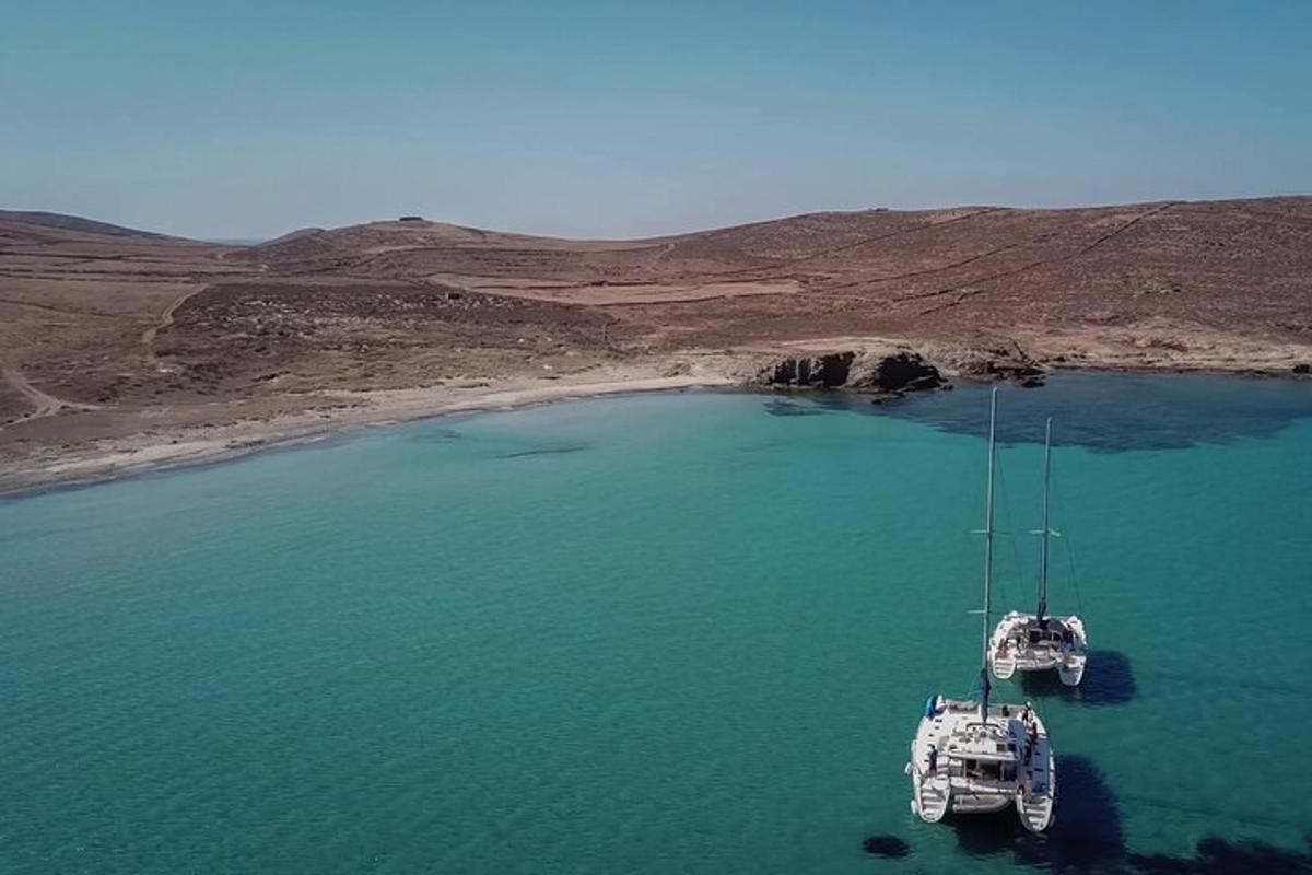 two boats are floating in a body of water