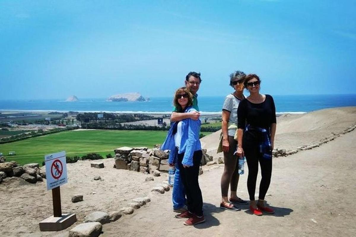 a group of people standing on top of a hill