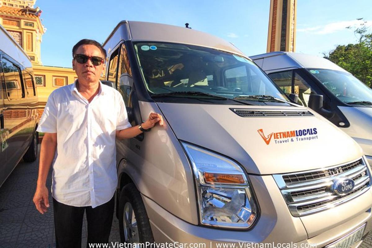 a man standing in front of a white van