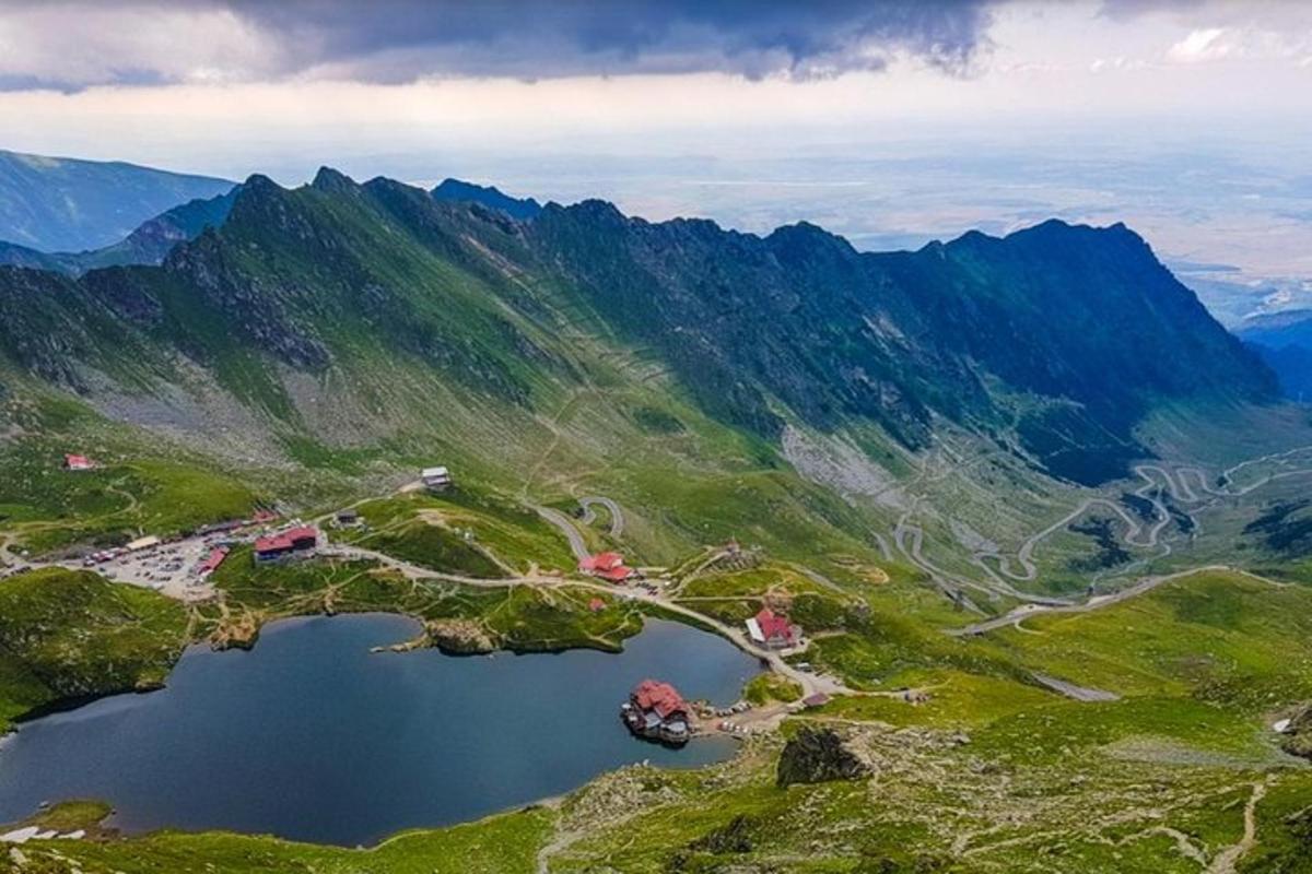 an aerial view of a mountain with a lake