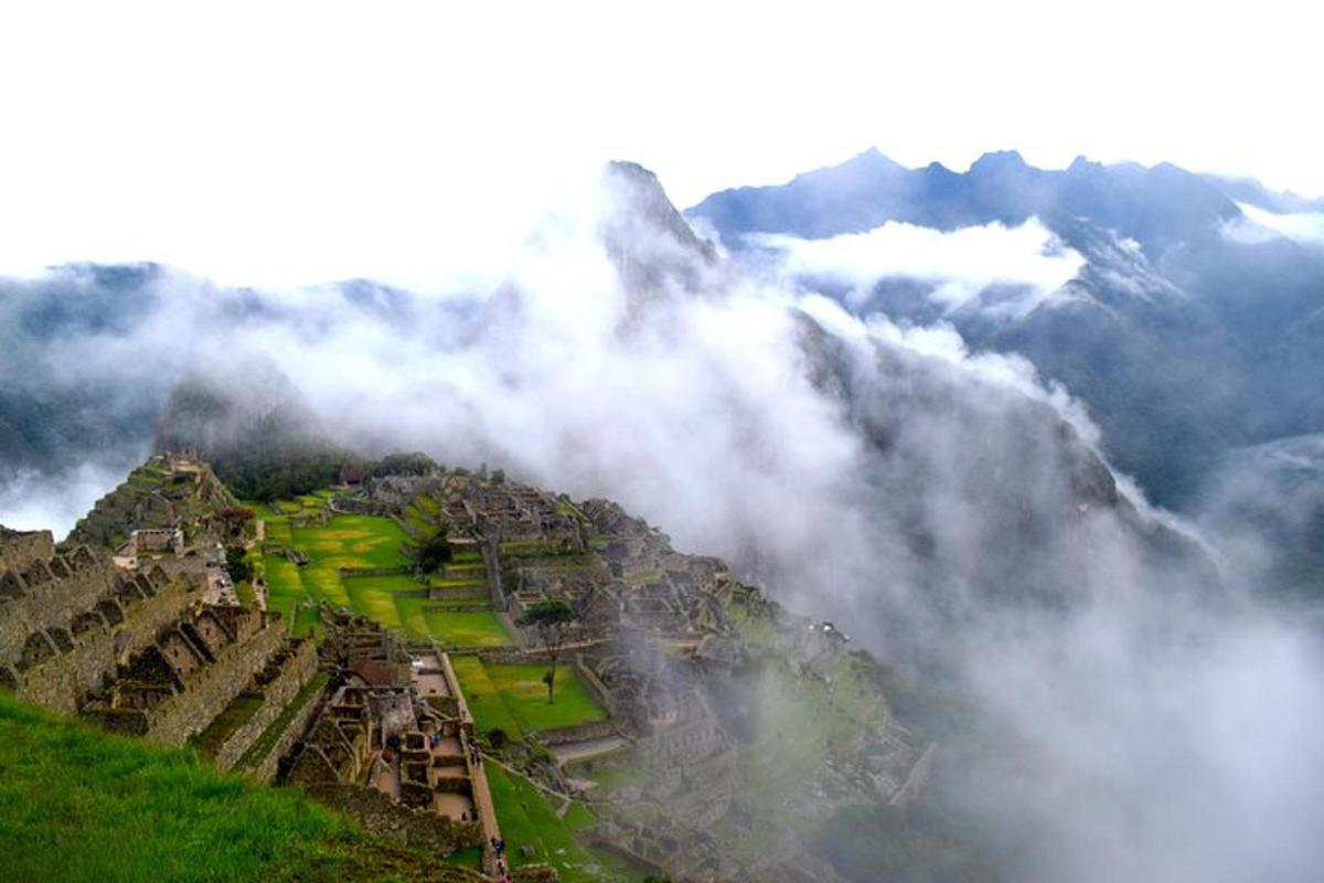 a city on top of a mountain in the clouds