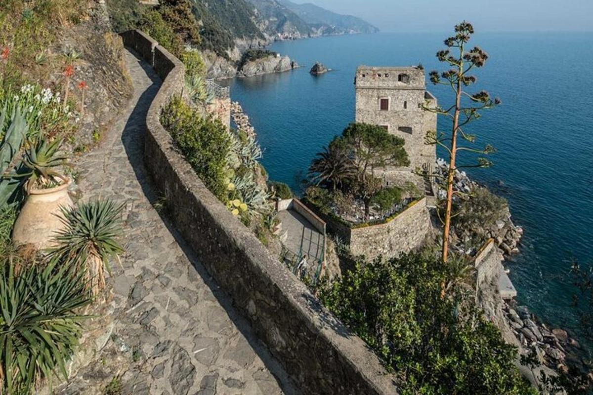 an old building on the side of a cliff