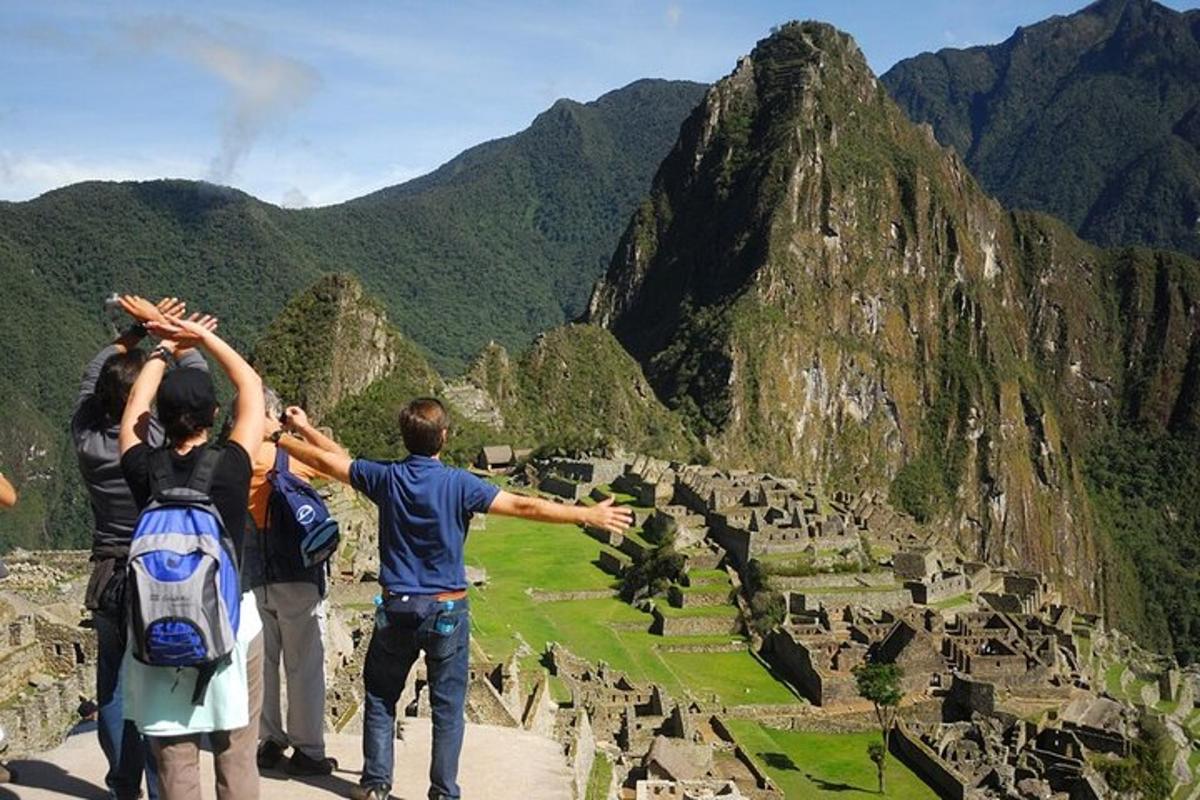 a group of people standing on top of a mountain