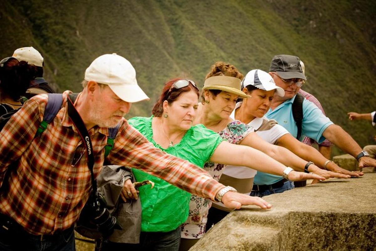 a group of people standing on a rock