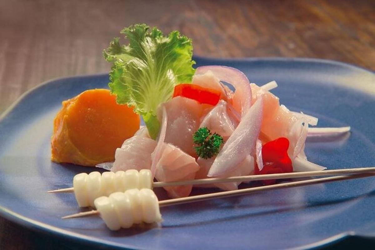 a blue plate of food on a table with chopsticks