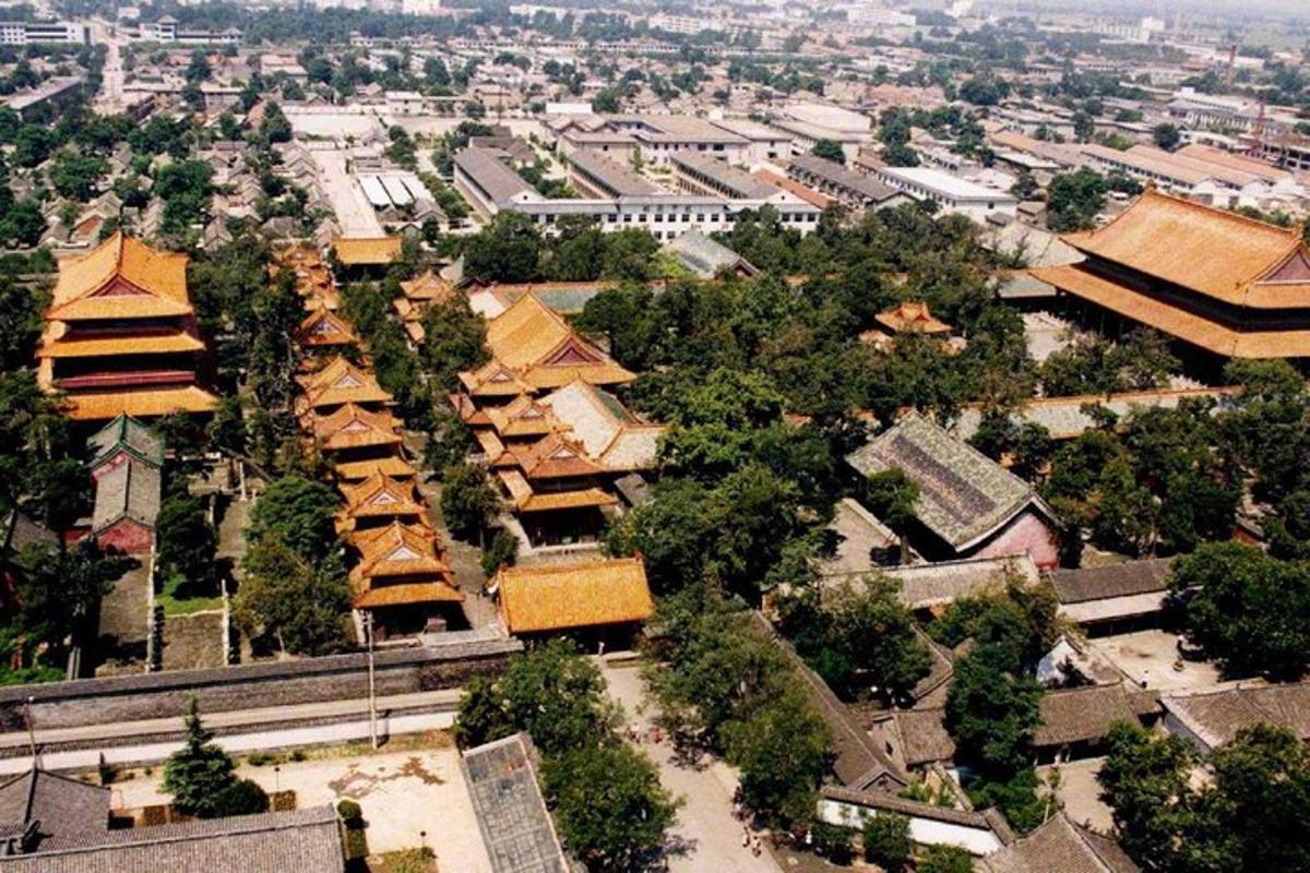 an overhead view of a city with buildings and trees