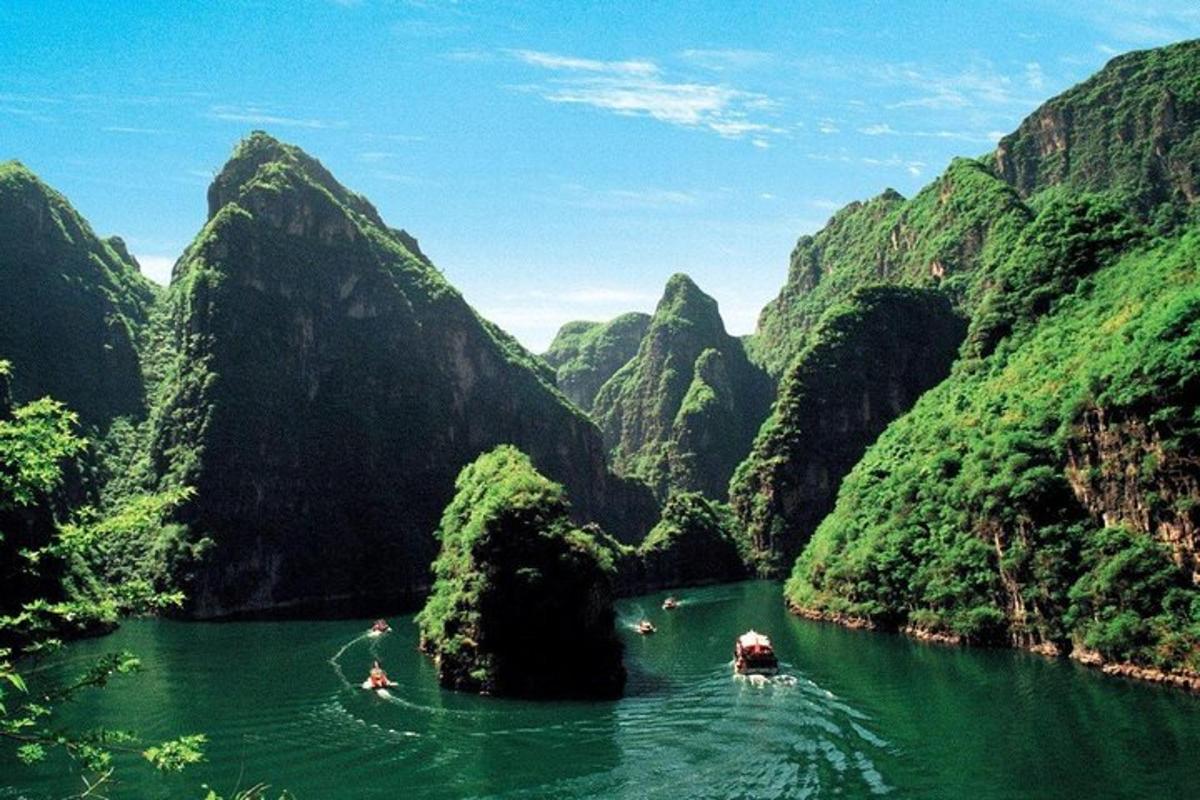 a boat in a river in a mountain canyon