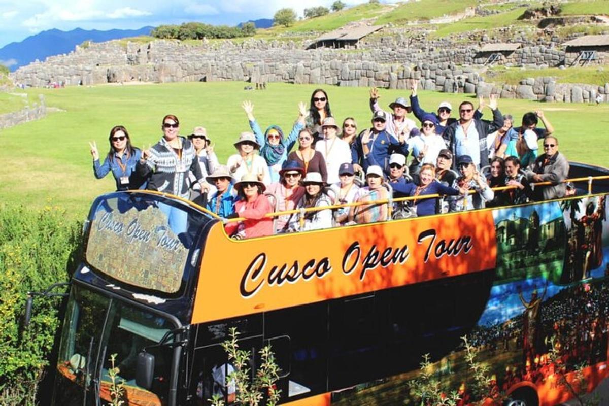 a group of people riding on a double decker bus