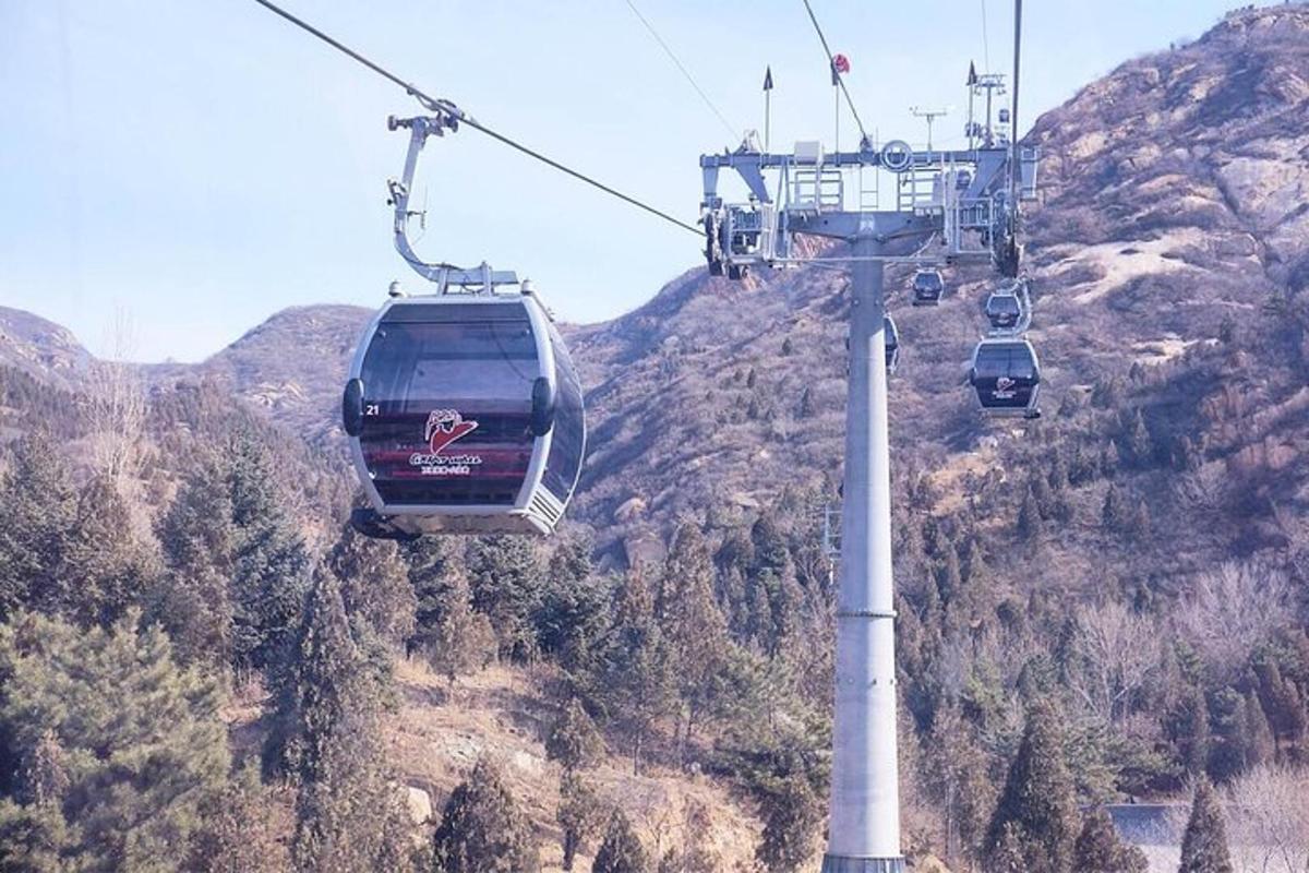 a group of gondolas on a ski lift over a mountain