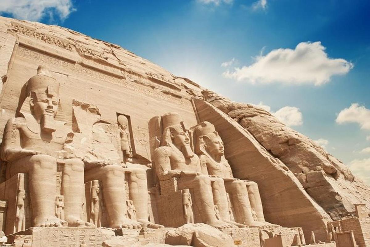 a large monument with statues on the side of a hill
