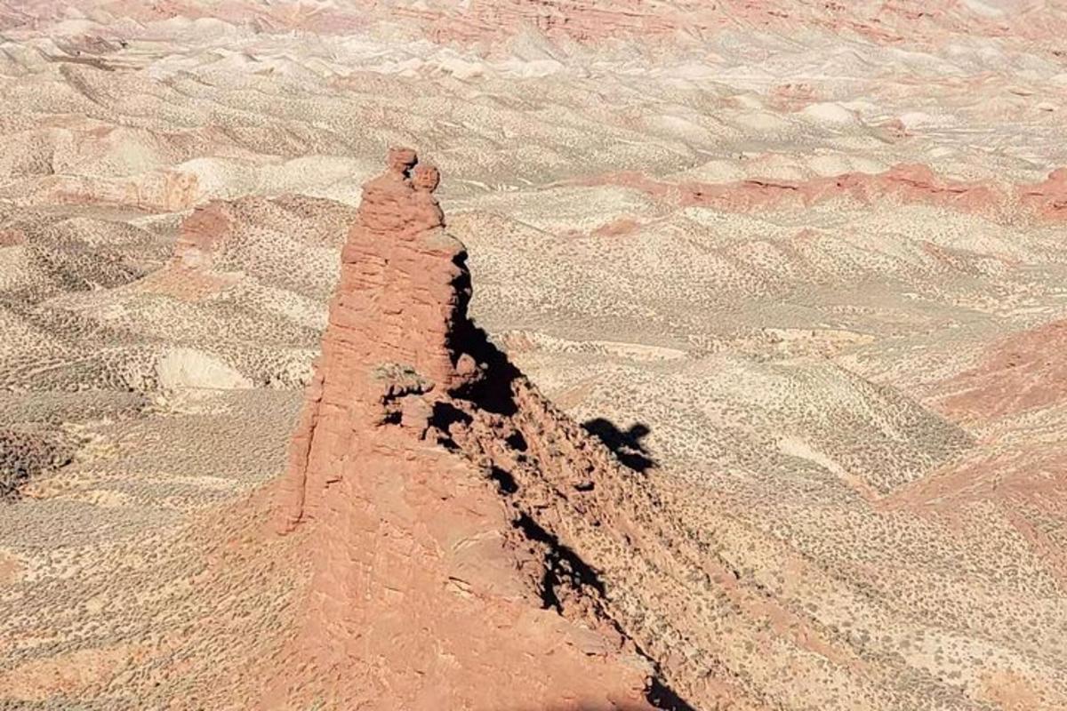 a sand pyramid in the middle of the desert