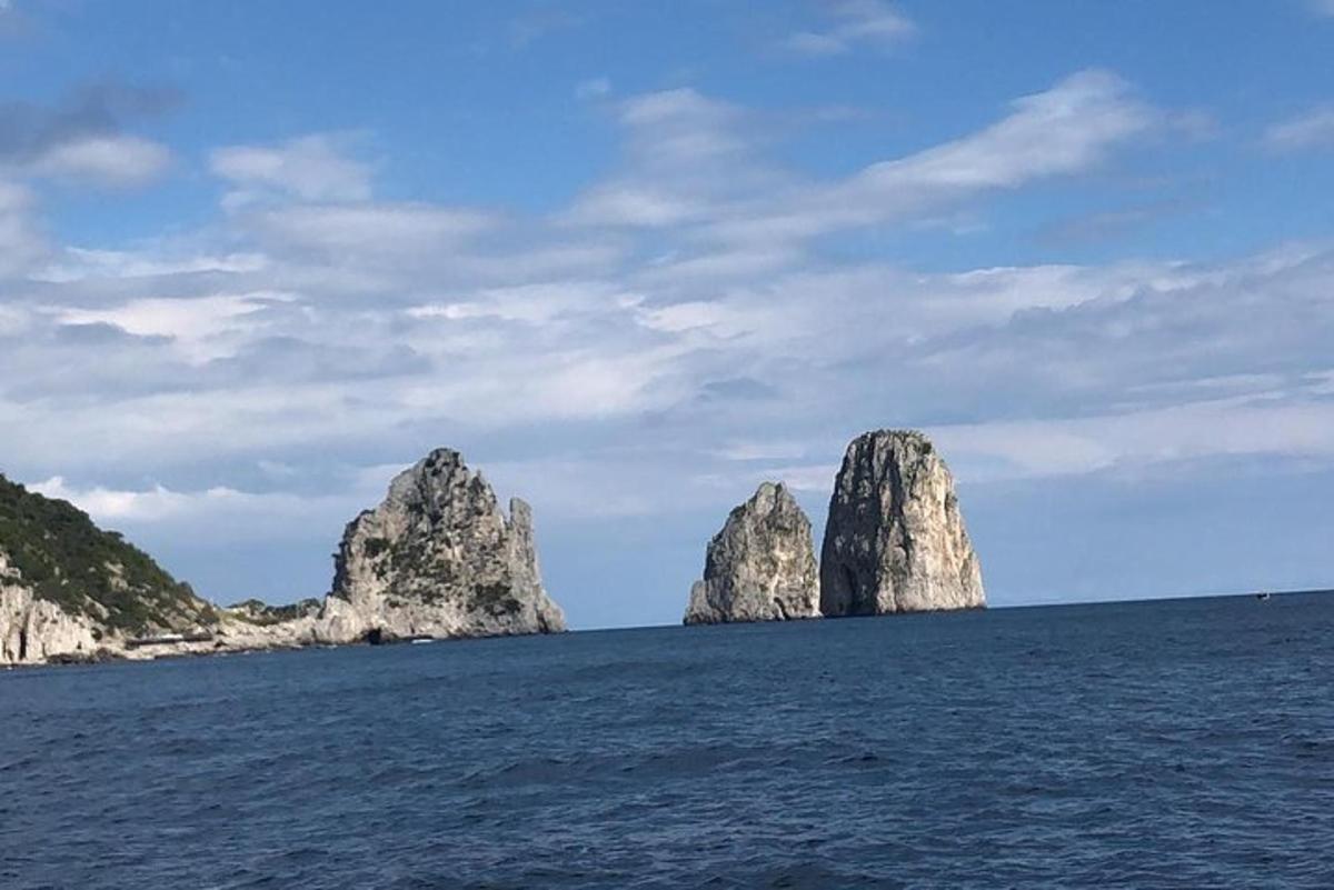 a group of large rocks in the water