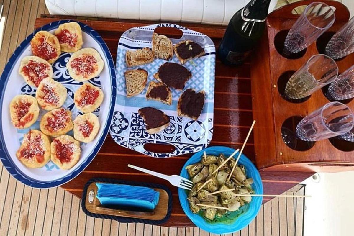 a table with two plates of food and a bowl of food