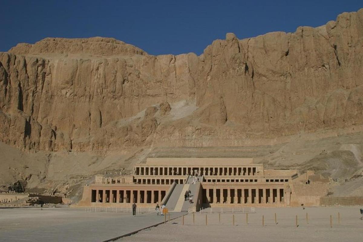 a building in front of a rocky mountain