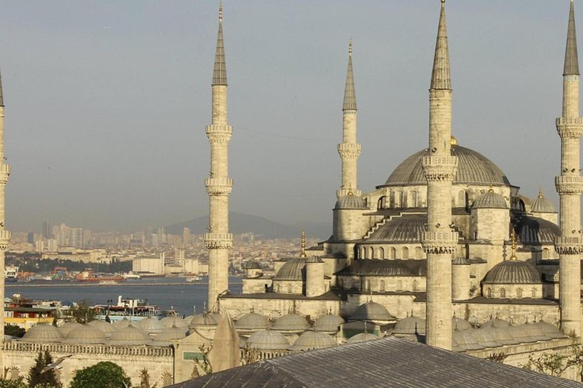 a building with domes and mosques in a city