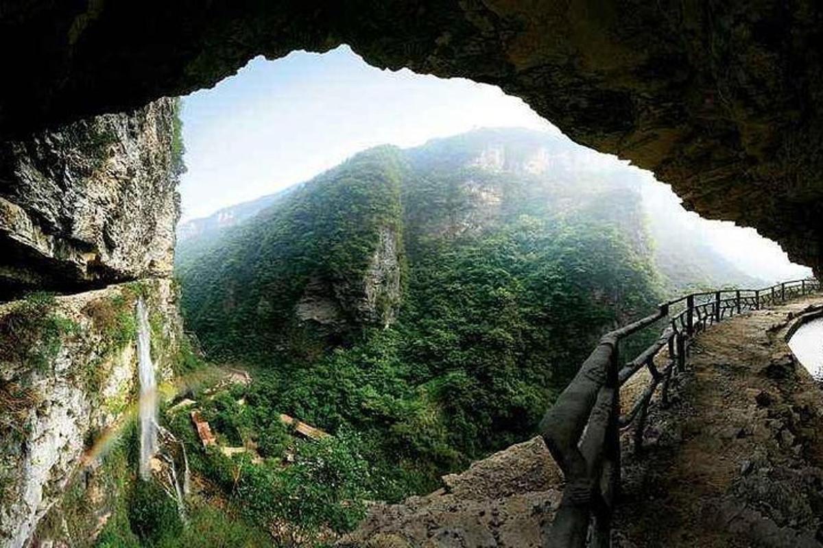 a view from inside a cave of a mountain