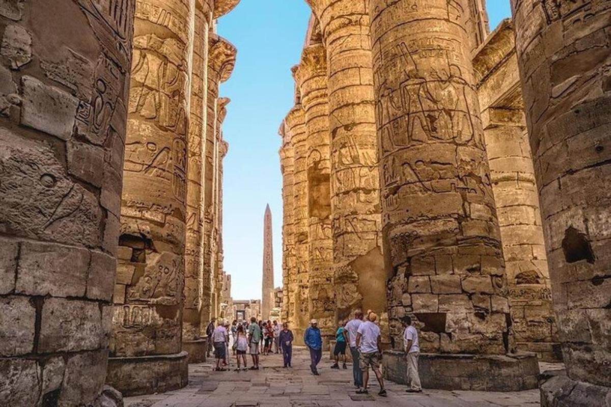 a group of people walking through the ruins of a building