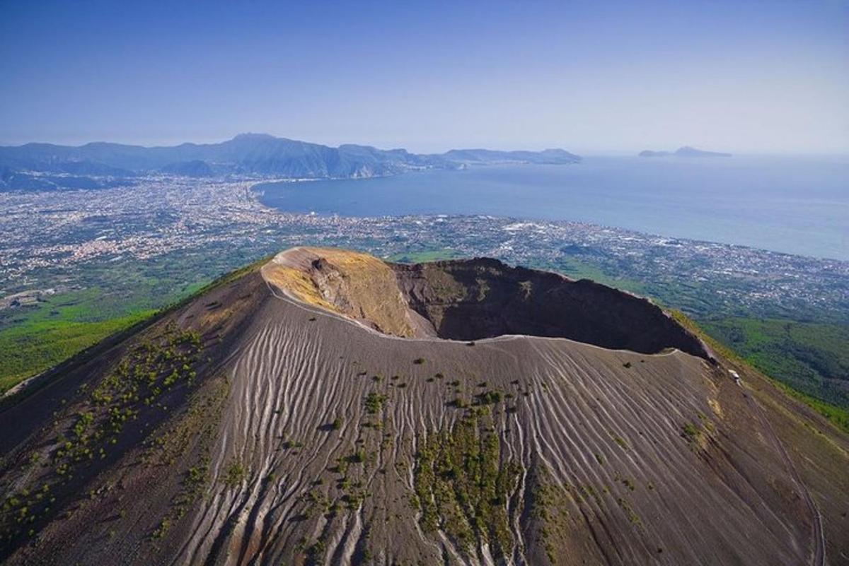 an aerial view of a mountain with the ocean