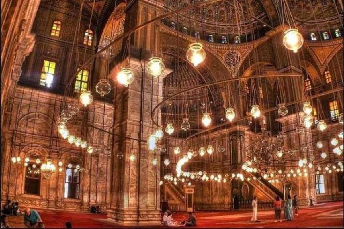 a large room with many lights in a building