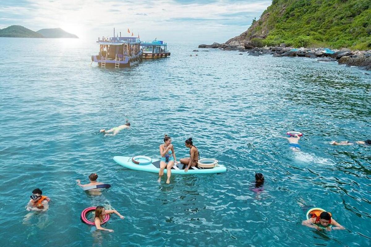 a group of people swimming in the water