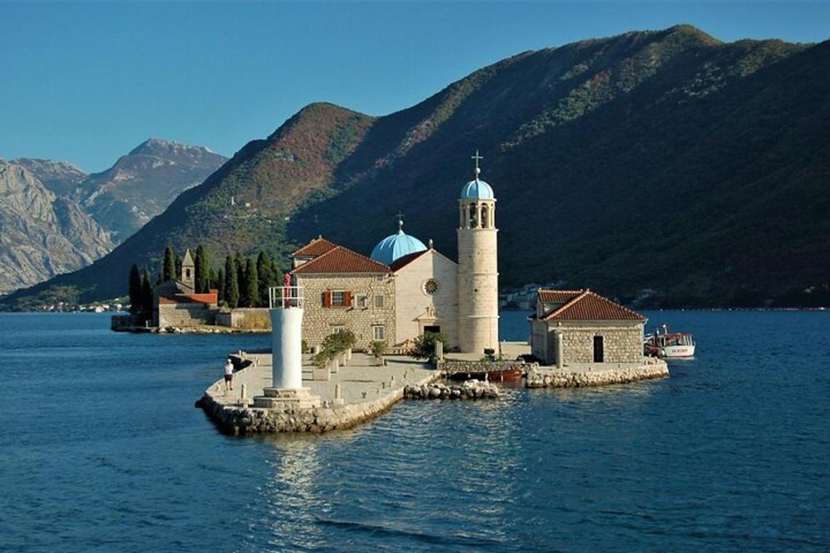 an island with a church in the middle of the water