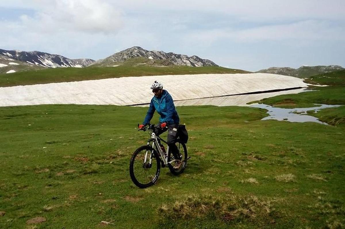 a person riding a bike in a field