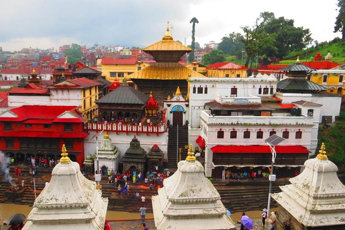 a group of buildings with red and white roofs