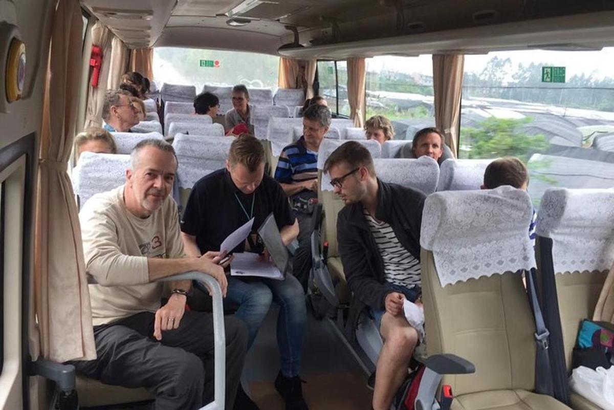 a group of people sitting on a bus