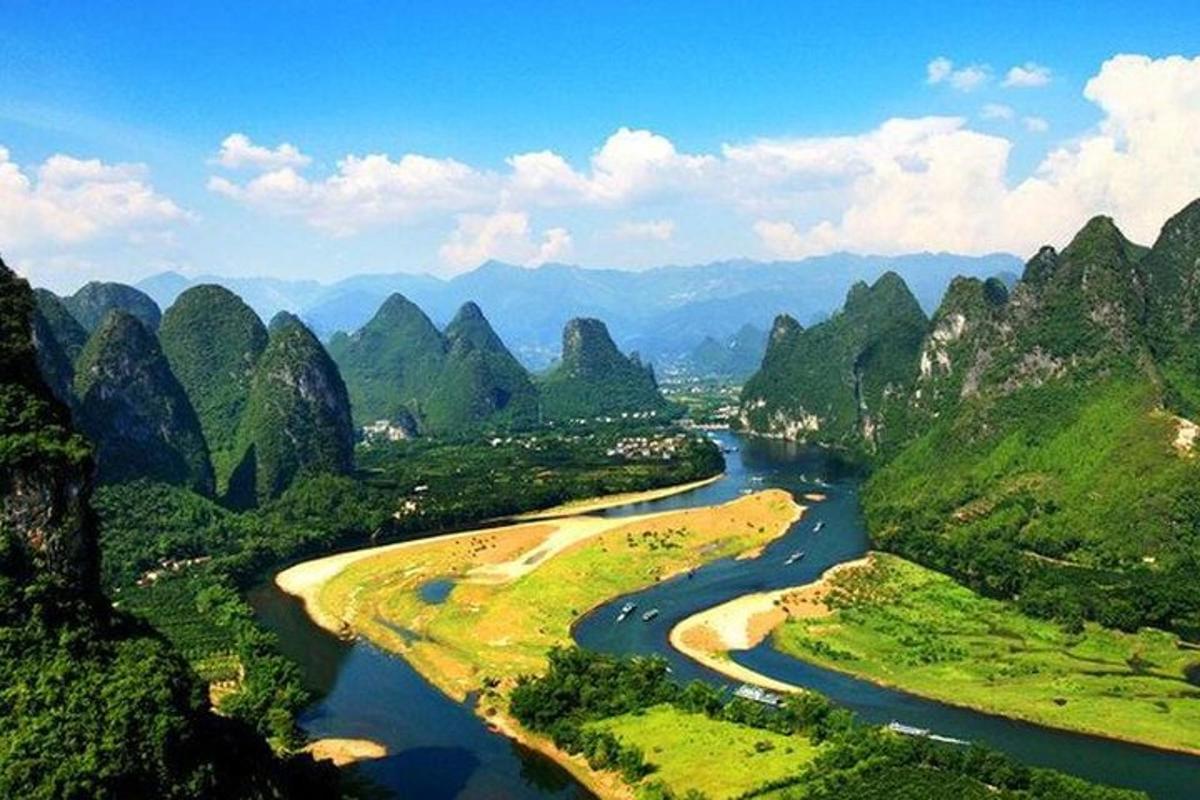 an aerial view of a river in a mountain valley