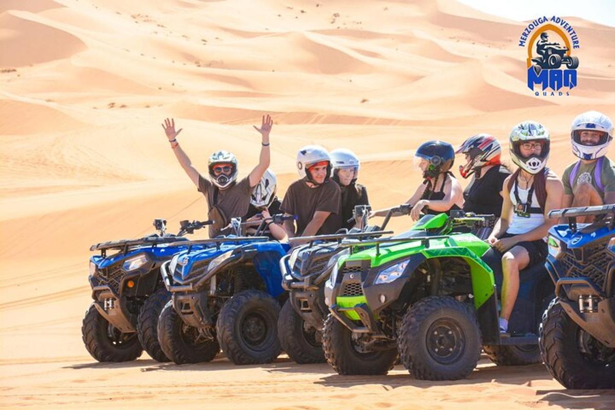 a group of people on atvs in the desert