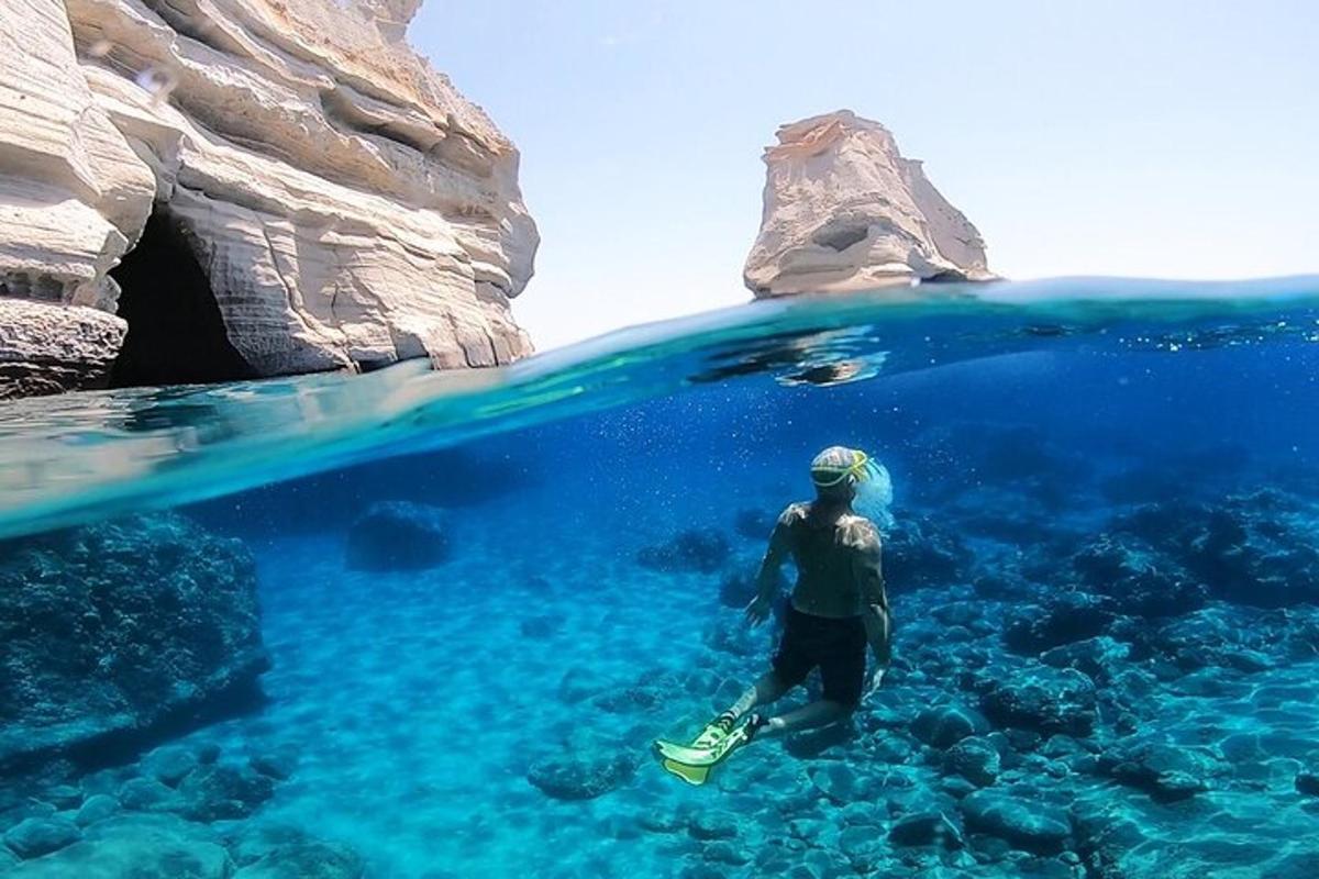 a man standing in the water in the ocean