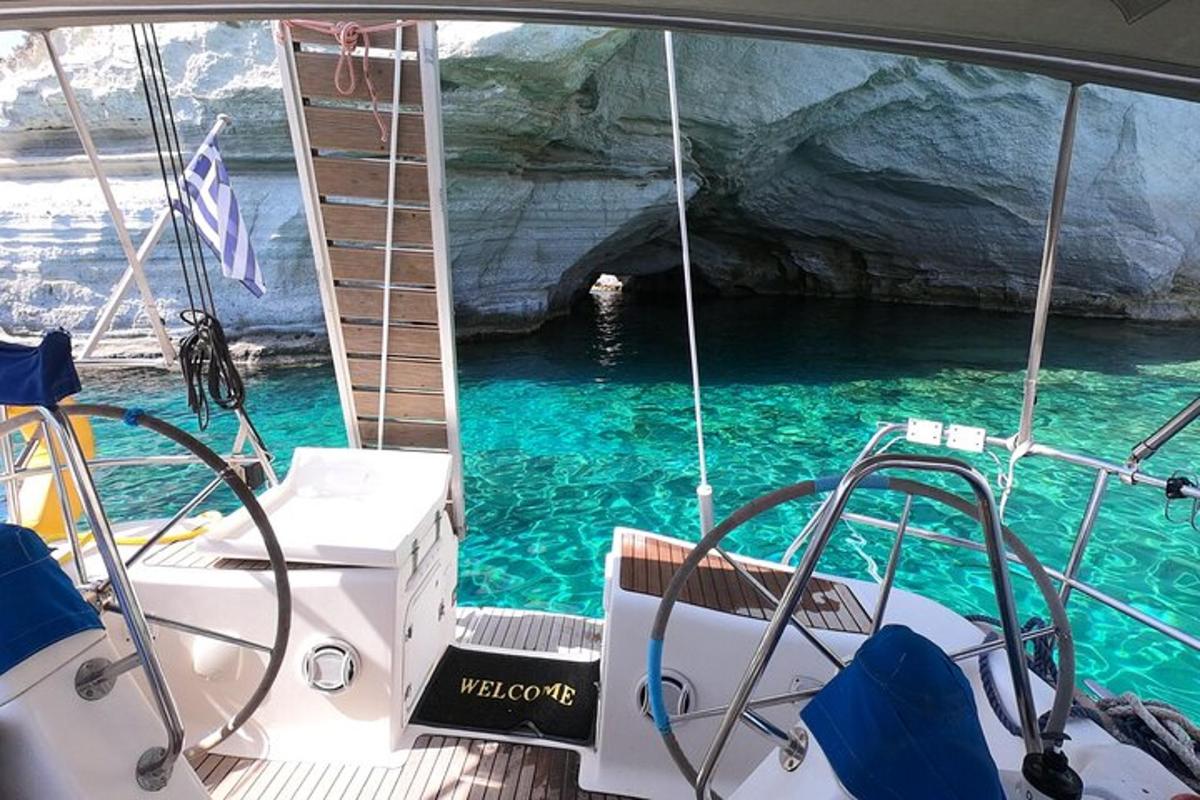 a boat in front of a cave in the water