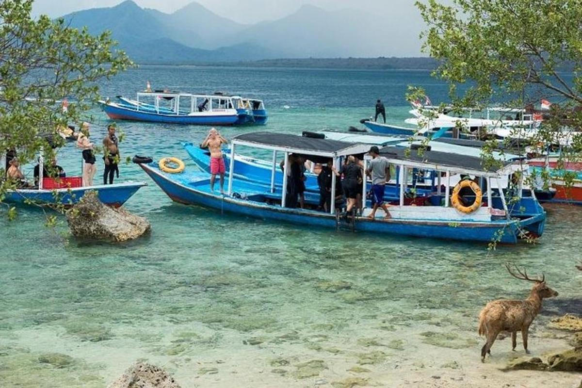a group of people on a boat in the water