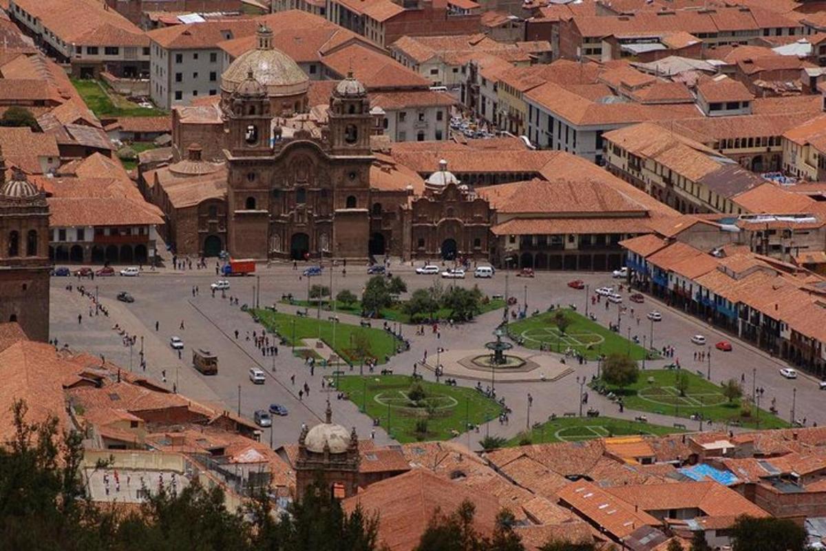 an aerial view of a city with a large building
