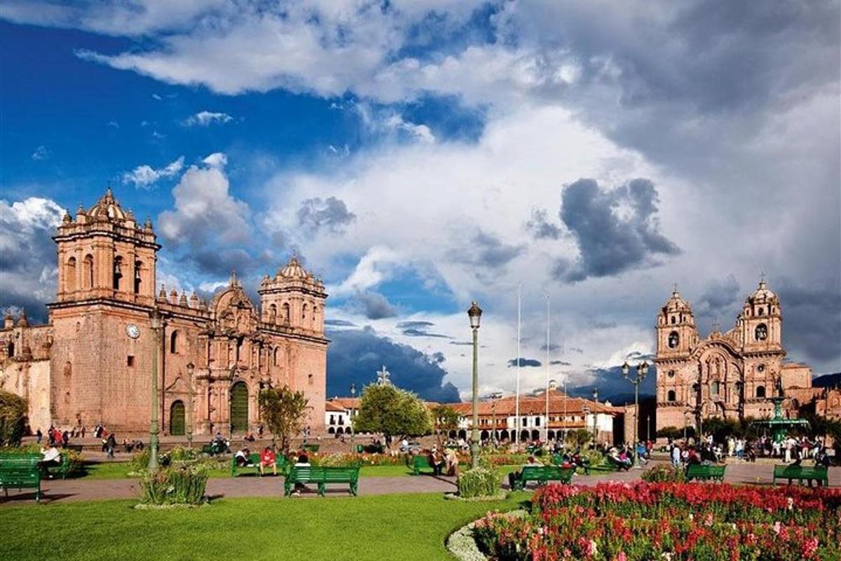 a large building with a park in front of it