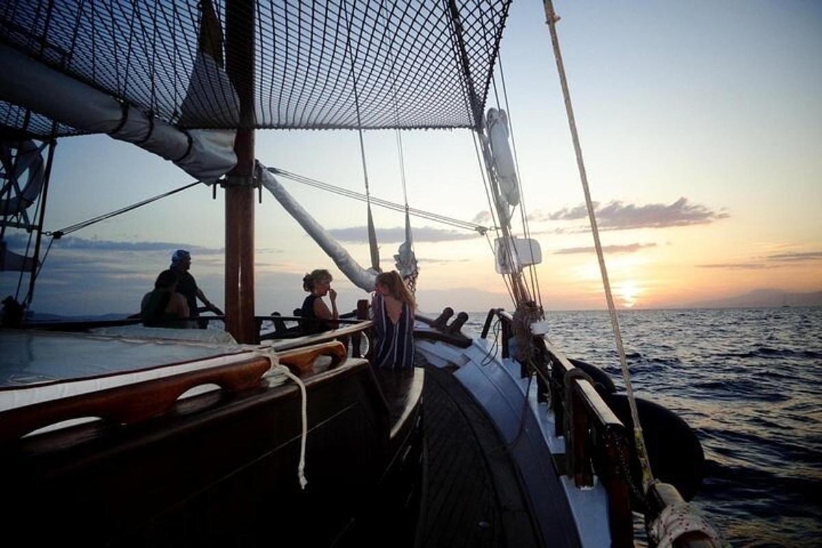 a group of people on a boat in the ocean