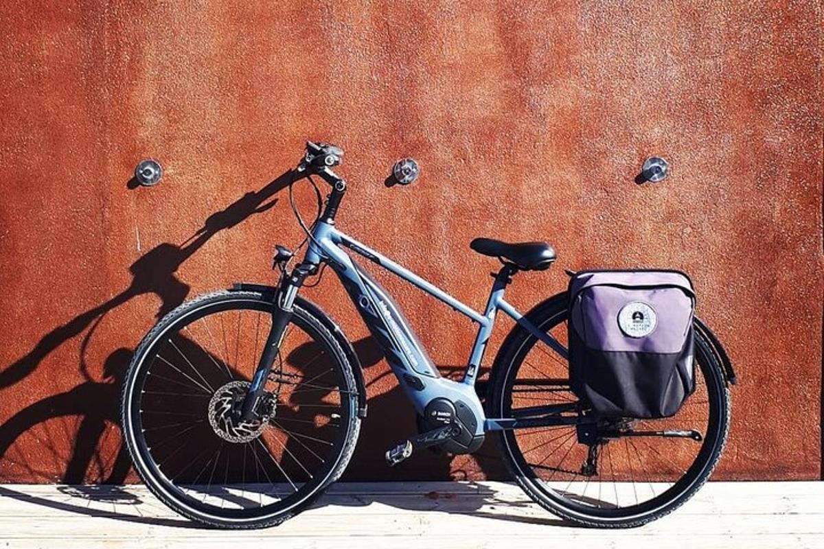 a bike parked in front of a orange wall