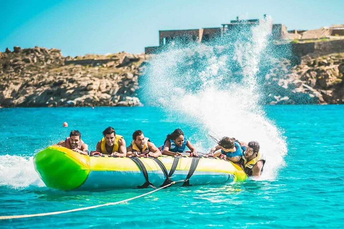 a group of children on a raft in the water