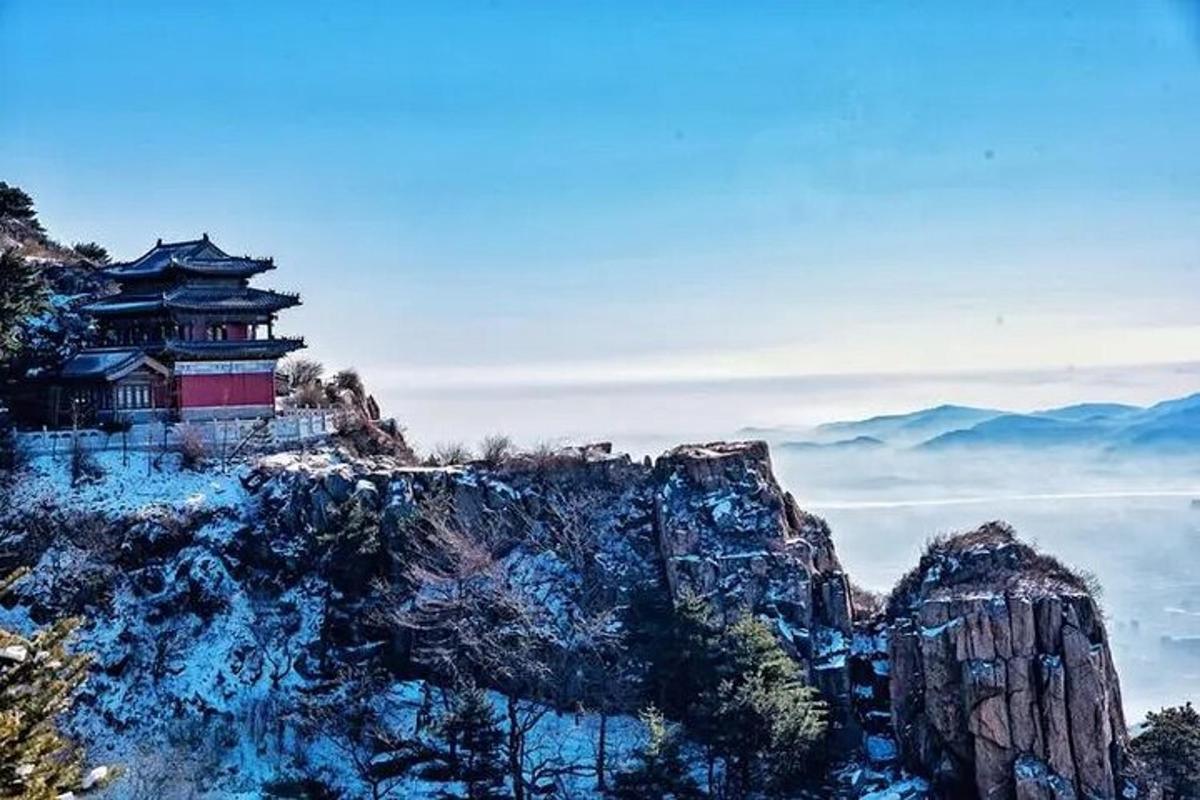 a chinese building on top of a mountain