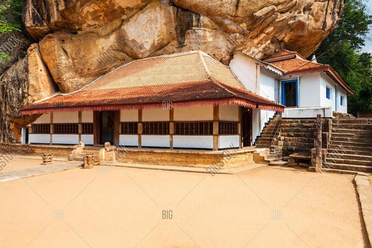 a temple in front of a rock wall