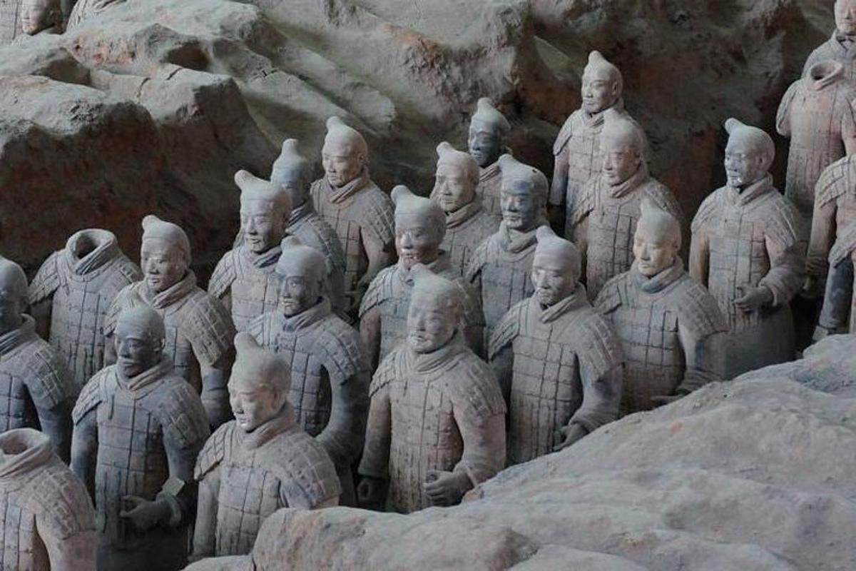 a large group of statues of men in uniforms