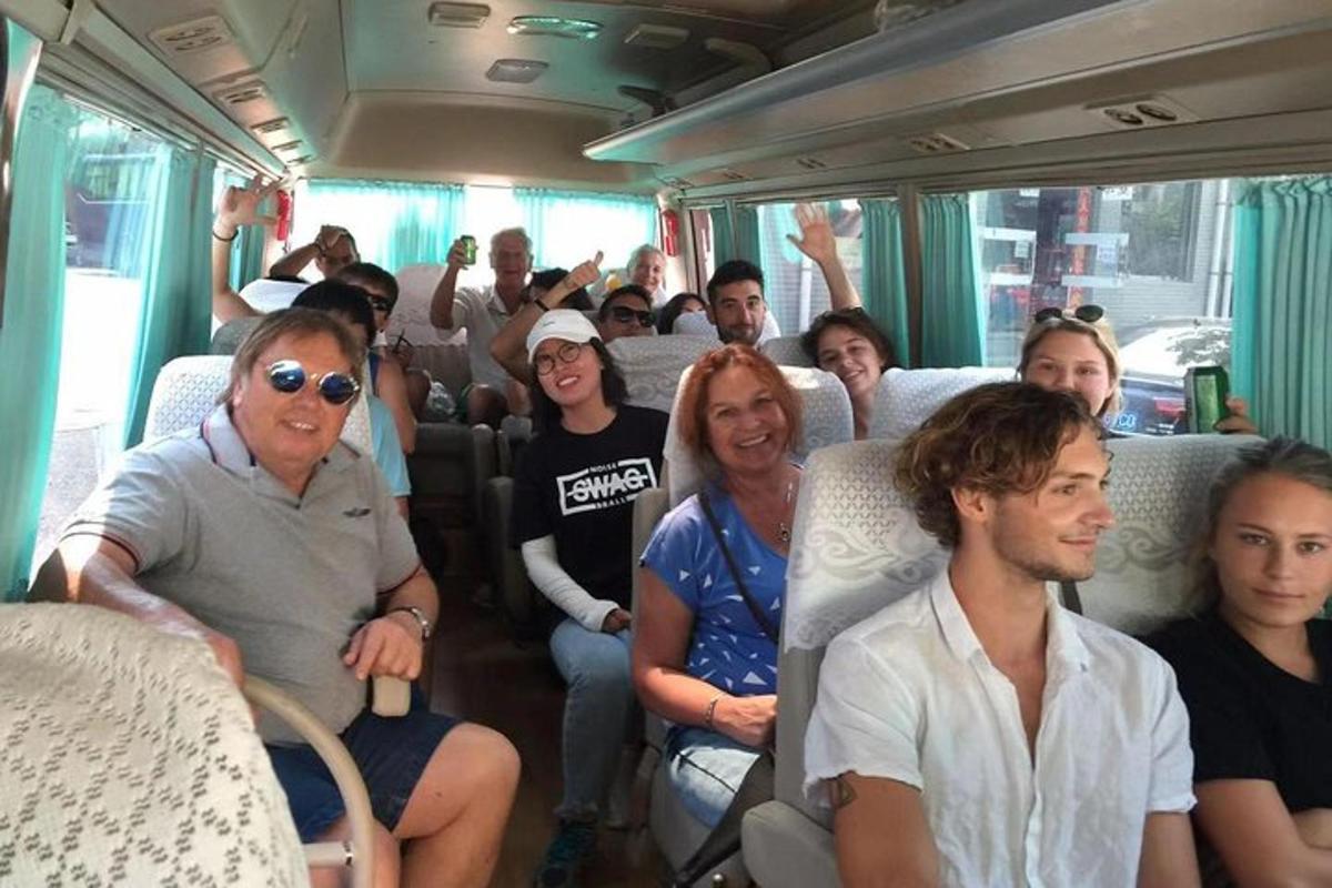 a group of people sitting on a bus