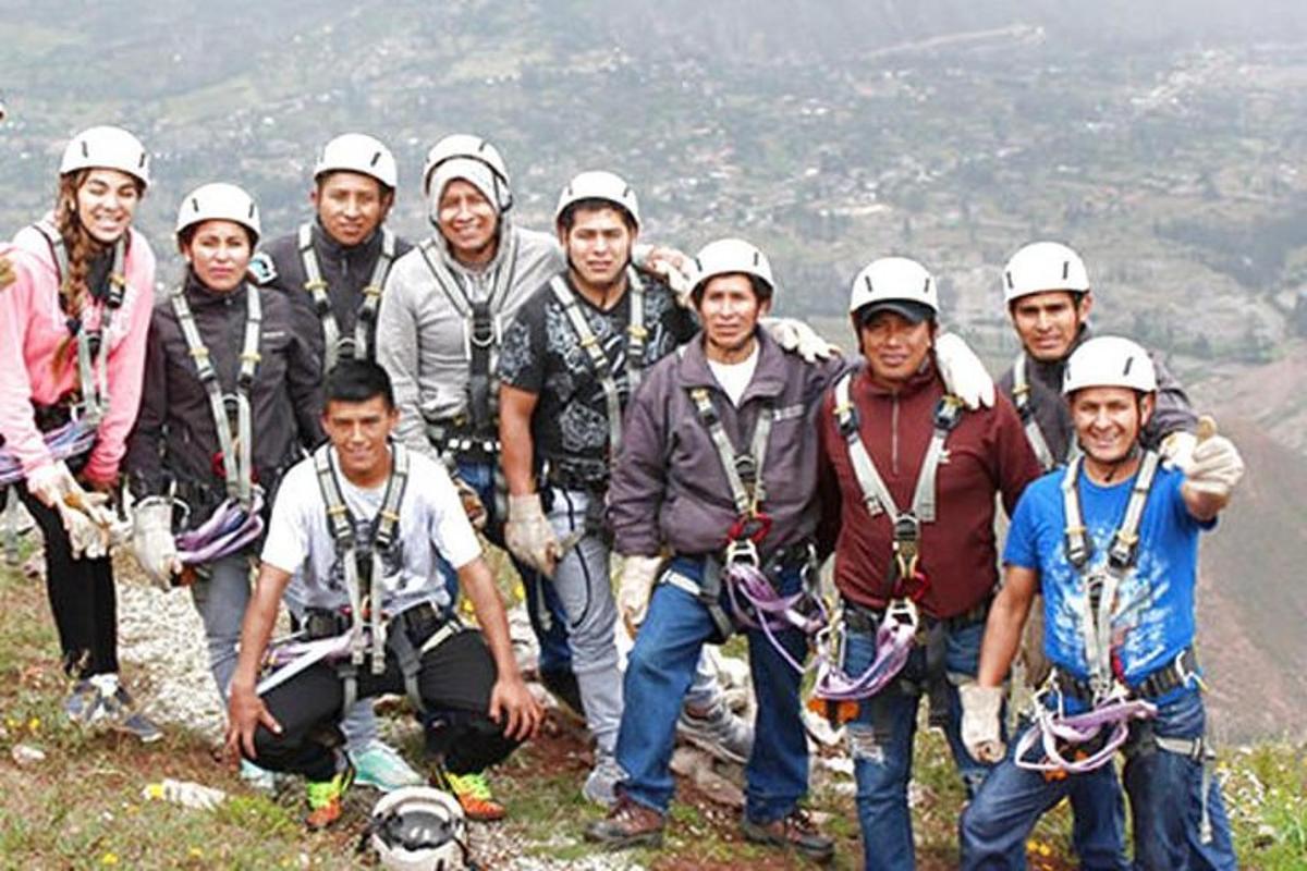 a group of people standing on top of a mountain